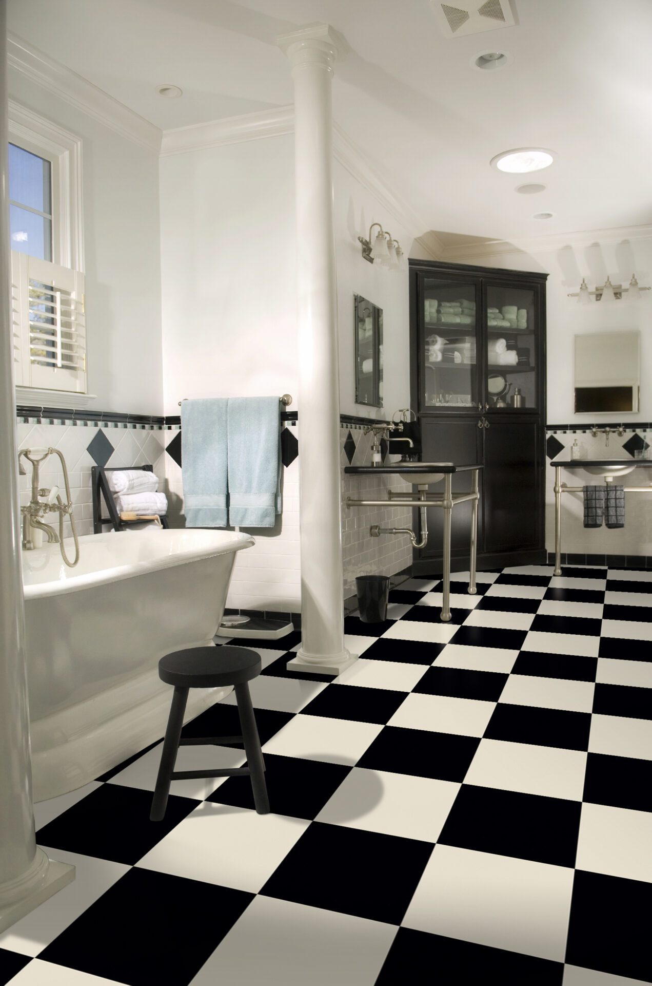 black and white checkered bathroom with a black and white floor