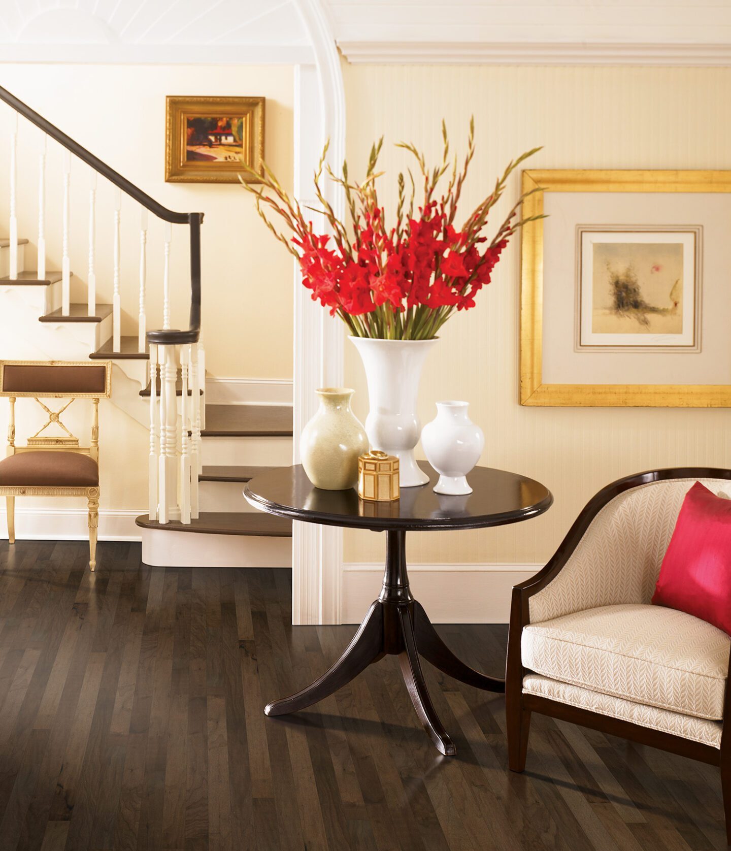 a living room with a hardwood floor and a variety of furniture